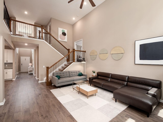 404 Colony Ridge Dr, Delaware, OH 43015 - living area featuring a high ceiling, ceiling fan, stairs, dark wood finished floors, and recessed lighting