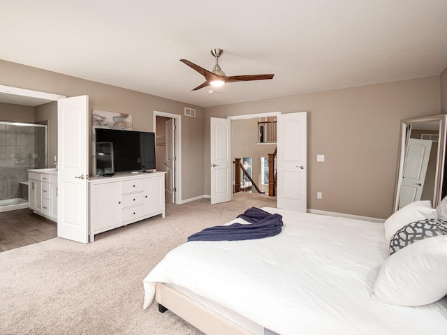 404 Colony Ridge Dr, Delaware, OH 43015 - bedroom with light colored carpet, ensuite bath, and ceiling fan