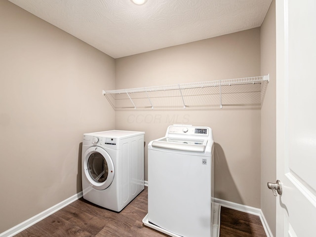 404 Colony Ridge Dr, Delaware, OH 43015 - laundry area featuring separate washer and dryer and dark wood finished floors