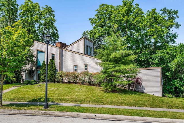 933 Creek Run Ct, Westerville, OH 43081 - view of home's exterior featuring a lawn and a chimney