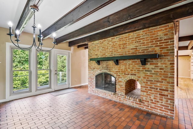 933 Creek Run Ct, Westerville, OH 43081 - unfurnished living room featuring brick floors, beam ceiling, and a brick fireplace