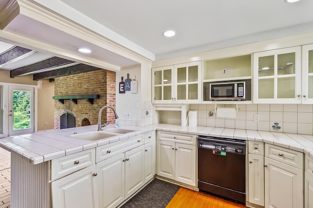 933 Creek Run Ct, Westerville, OH 43081 - kitchen featuring dishwashing machine, stainless steel microwave, a peninsula, white cabinetry, and backsplash