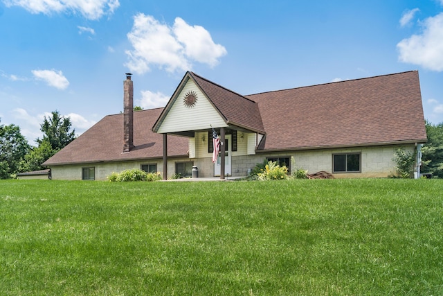 5795 Royalton Rd SW, Lancaster, OH 43130 - view of front of house featuring roof with shingles, a chimney, and a front yard