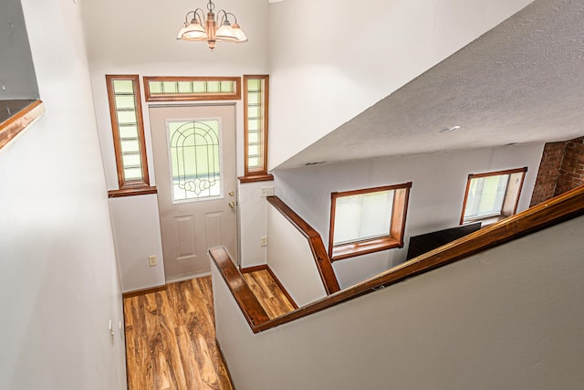 5795 Royalton Rd SW, Lancaster, OH 43130 - foyer with wood finished floors, plenty of natural light, a chandelier, and a textured ceiling