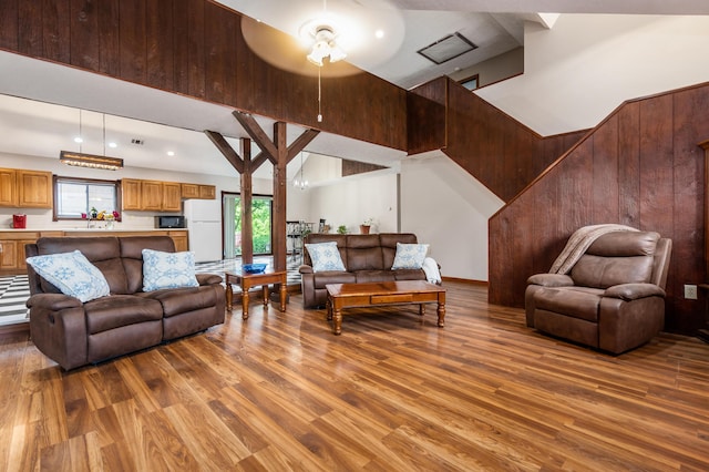 5795 Royalton Rd SW, Lancaster, OH 43130 - living room featuring wood finished floors, a high ceiling, ceiling fan, wood walls, and recessed lighting