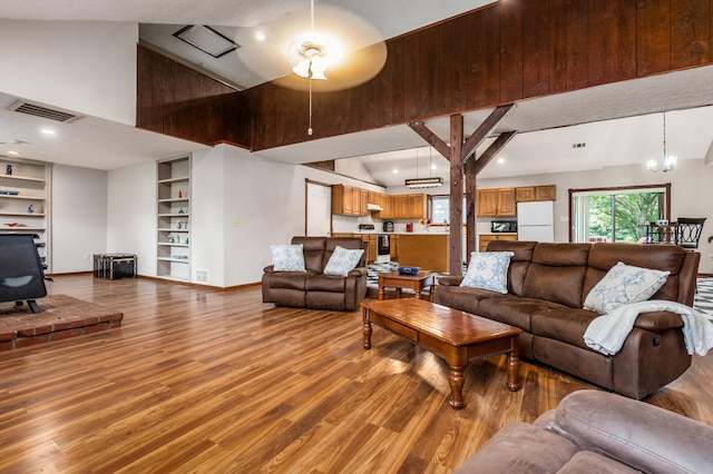 5795 Royalton Rd SW, Lancaster, OH 43130 - living room with high vaulted ceiling, light wood-type flooring, ceiling fan, built in shelves, and recessed lighting
