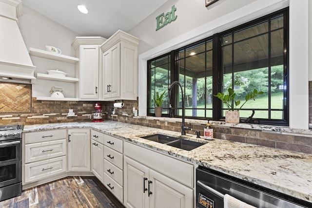 19694 State Route 60, Warsaw, OH 43844 - kitchen with custom range hood, stainless steel range oven, dishwasher, open shelves, and white cabinets