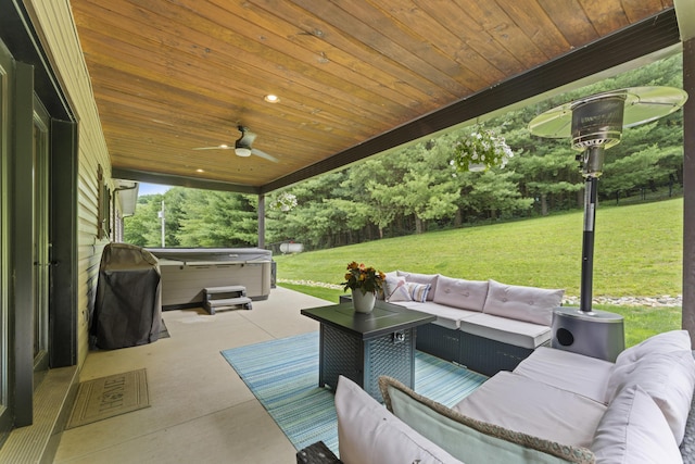 19694 State Route 60, Warsaw, OH 43844 - fenced backyard featuring a hot tub, outdoor lounge area, a patio area, a ceiling fan, and grilling area