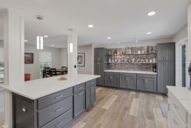 7881 Saddle, Powell, OH 43065 - kitchen featuring gray cabinets, open shelves, light wood-style floors, hanging light fixtures, and recessed lighting
