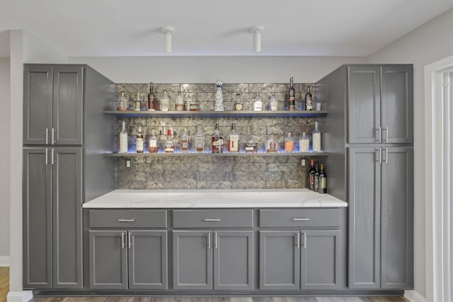 7881 Saddle, Powell, OH 43065 - indoor dry bar featuring wood finished floors and baseboards