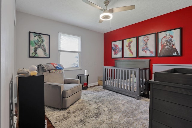 7881 Saddle, Powell, OH 43065 - bedroom featuring a nursery area, ceiling fan, and carpet