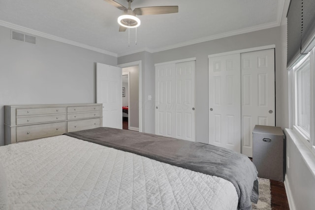 7881 Saddle, Powell, OH 43065 - bedroom featuring multiple closets, crown molding, wood finished floors, and a ceiling fan