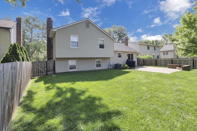 7881 Saddle, Powell, OH 43065 - back of property featuring a patio, a fenced backyard, and a chimney