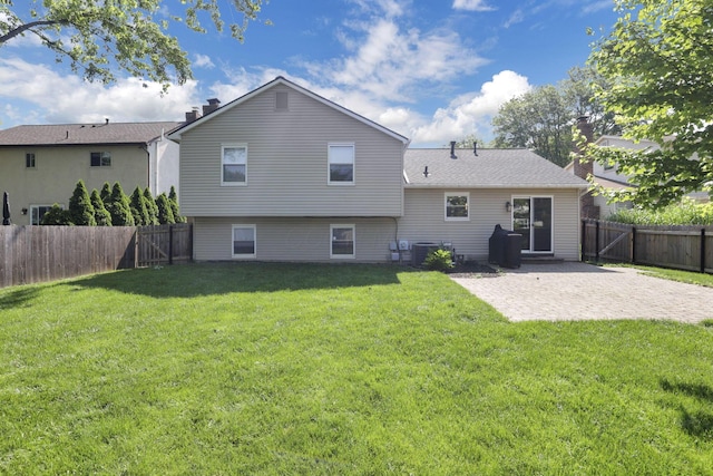 7881 Saddle, Powell, OH 43065 - back of house with a patio area, a fenced backyard, and a chimney