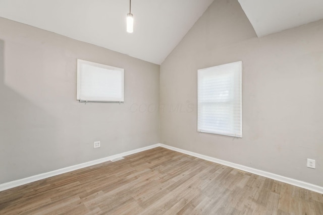 1328 Republic Ave, Columbus, OH 43211 - spare room with light wood finished floors, healthy amount of natural light, and lofted ceiling