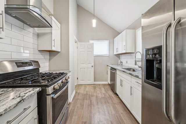 1328 Republic Ave, Columbus, OH 43211 - kitchen with appliances with stainless steel finishes, wall chimney exhaust hood, tasteful backsplash, lofted ceiling, and light wood-style floors