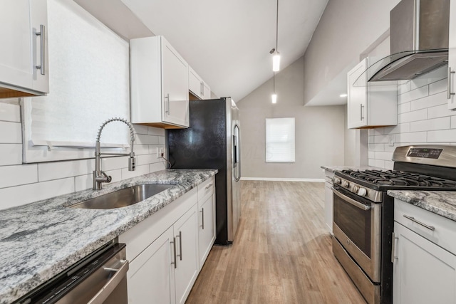 1328 Republic Ave, Columbus, OH 43211 - kitchen with stainless steel appliances, wall chimney exhaust hood, backsplash, white cabinetry, and high vaulted ceiling
