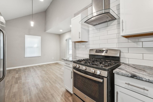 1328 Republic Ave, Columbus, OH 43211 - kitchen with stainless steel gas stove, range hood, light stone countertops, light wood-style floors, and high vaulted ceiling
