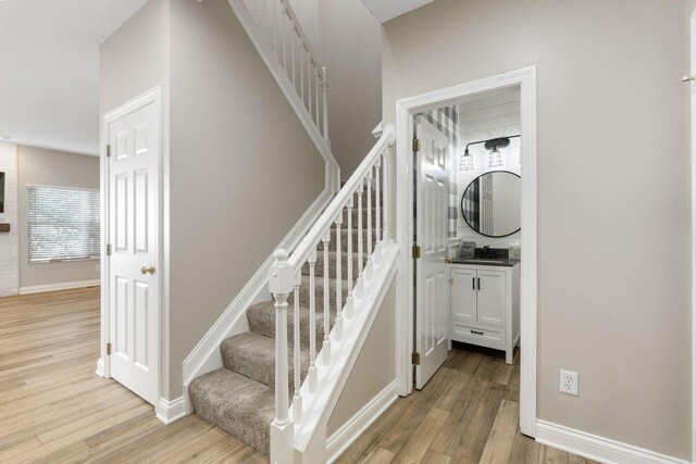 3984 Hill Park Rd, Hilliard, OH 43026 - stairs with wood finished floors and baseboards
