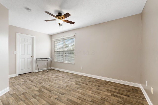 3984 Hill Park Rd, Hilliard, OH 43026 - spare room featuring ceiling fan, wood finished floors, and a smoke detector