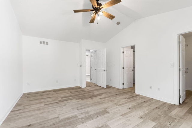 3984 Hill Park Rd, Hilliard, OH 43026 - unfurnished bedroom with a spacious closet, lofted ceiling, light wood-style floors, ceiling fan, and ensuite bathroom
