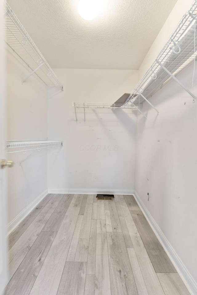 3984 Hill Park Rd, Hilliard, OH 43026 - spacious closet featuring wood finished floors