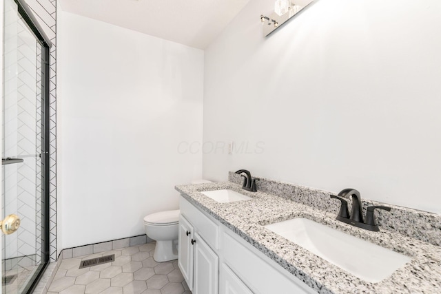 3984 Hill Park Rd, Hilliard, OH 43026 - bathroom featuring double vanity, a shower stall, and tile patterned flooring