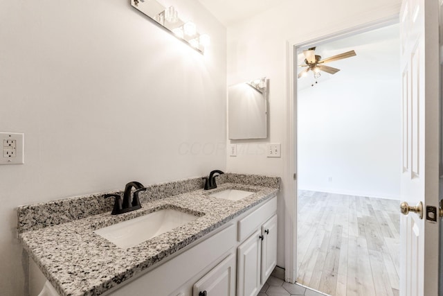 3984 Hill Park Rd, Hilliard, OH 43026 - bathroom with a ceiling fan, double vanity, and wood finished floors