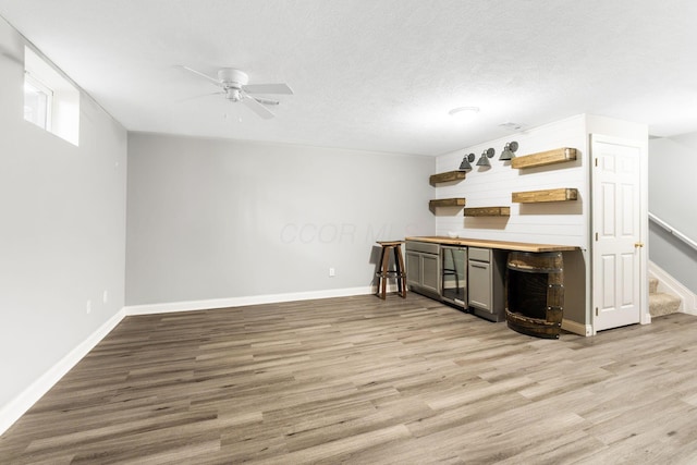 3984 Hill Park Rd, Hilliard, OH 43026 - indoor dry bar with ceiling fan, stairs, light wood-style floors, and wine cooler