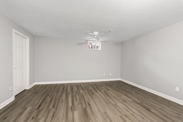 3984 Hill Park Rd, Hilliard, OH 43026 - unfurnished room with wood finished floors, a ceiling fan, and a textured ceiling