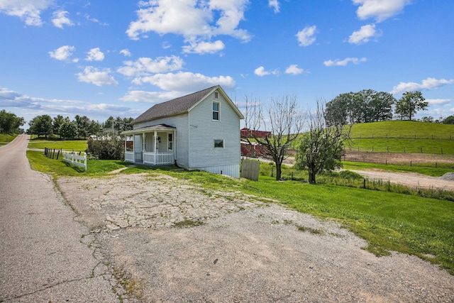 5505 Hopewell Church Rd SW, Lancaster, OH 43130 - view of side of home featuring a porch and a view of rural / pastoral area