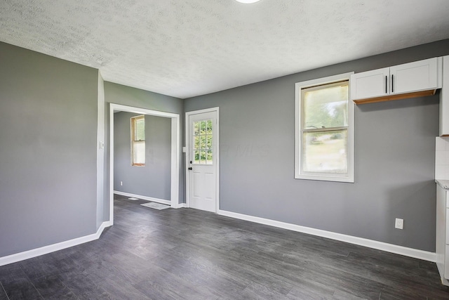 5505 Hopewell Church Rd SW, Lancaster, OH 43130 - empty room with a textured ceiling and dark wood-style flooring