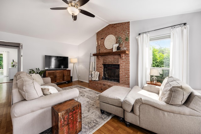 3776 Secretariat Ct, Columbus, OH 43221 - living area with wood finished floors, ceiling fan, healthy amount of natural light, lofted ceiling, and a brick fireplace