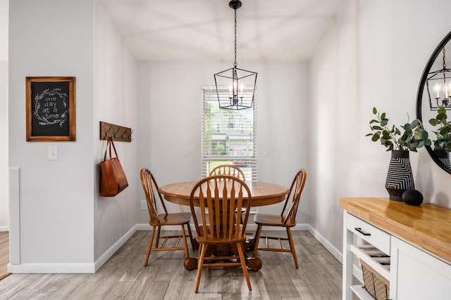3776 Secretariat Ct, Columbus, OH 43221 - dining area featuring a chandelier and light wood-style floors