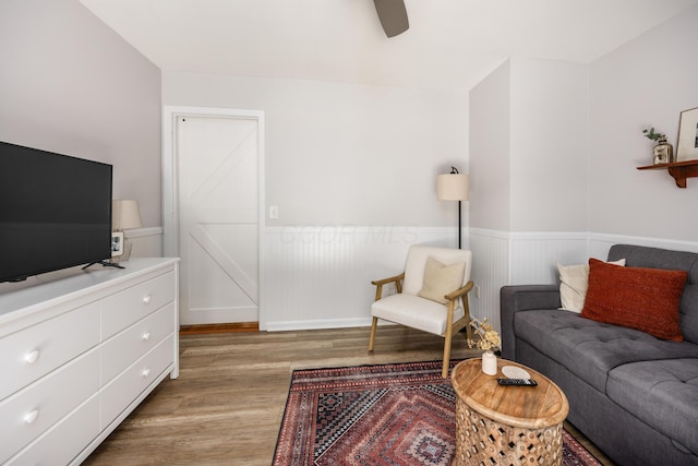 3776 Secretariat Ct, Columbus, OH 43221 - living area featuring wood finished floors, wainscoting, and a ceiling fan