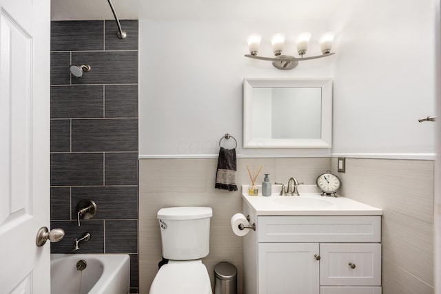3776 Secretariat Ct, Columbus, OH 43221 - bathroom featuring vanity, bathing tub / shower combination, and tile walls