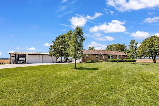 13283 Clover Valley Rd, Croton, OH 43013 - view of front facade with a front yard, gravel driveway, and an attached garage