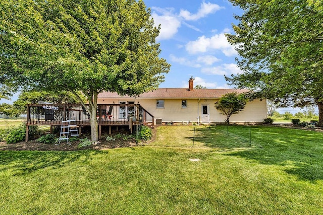 13283 Clover Valley Rd, Croton, OH 43013 - back of property with a deck, a lawn, and a chimney
