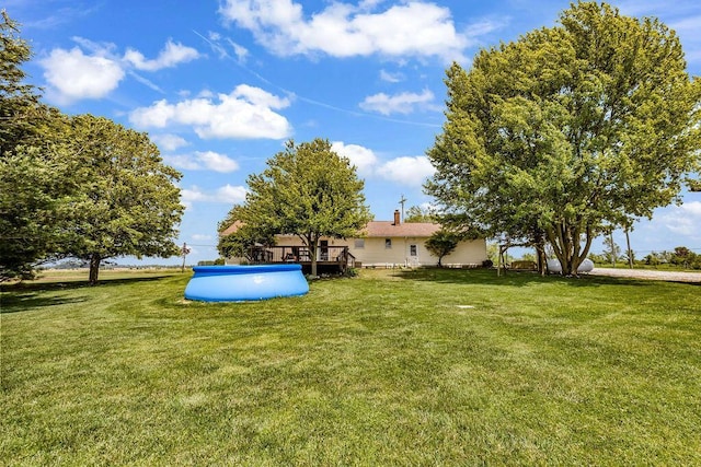 13283 Clover Valley Rd, Croton, OH 43013 - view of grassy yard featuring a wooden deck and a pool