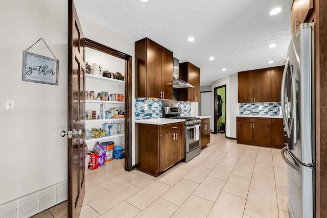 13283 Clover Valley Rd, Croton, OH 43013 - kitchen with stainless steel appliances, wall chimney range hood, light countertops, backsplash, and recessed lighting