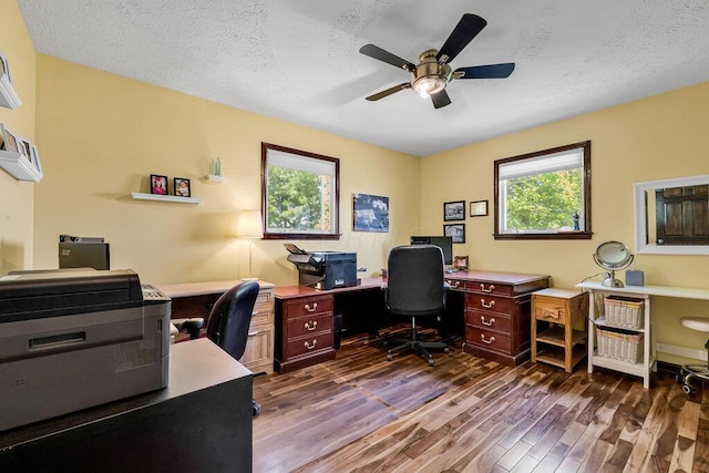 13283 Clover Valley Rd, Croton, OH 43013 - home office with healthy amount of natural light, dark wood-style floors, a ceiling fan, and a textured ceiling