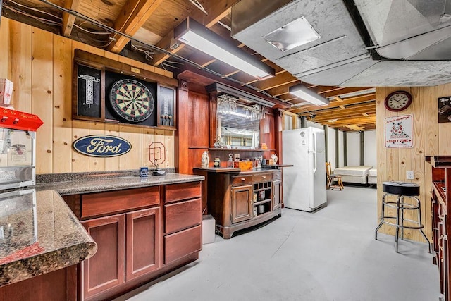 13283 Clover Valley Rd, Croton, OH 43013 - bar featuring freestanding refrigerator, wooden walls, and finished concrete floors