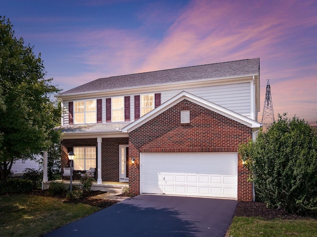 1719 Impatiens Way, Lewis Center, OH 43035 - traditional-style house with driveway, brick siding, a porch, and a shingled roof