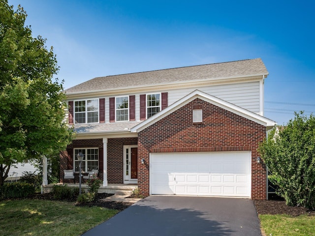 1719 Impatiens Way, Lewis Center, OH 43035 - traditional-style house with driveway, brick siding, and roof with shingles