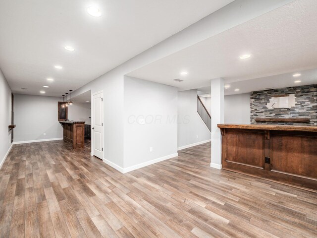 1719 Impatiens Way, Lewis Center, OH 43035 - indoor bar with light wood-style flooring, recessed lighting, and stairway