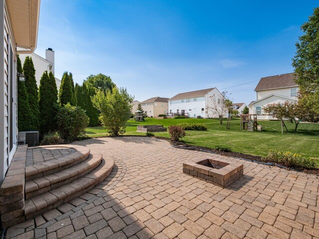 1719 Impatiens Way, Lewis Center, OH 43035 - view of patio featuring a fire pit and a residential view