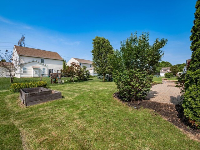 1719 Impatiens Way, Lewis Center, OH 43035 - view of grassy yard with a garden