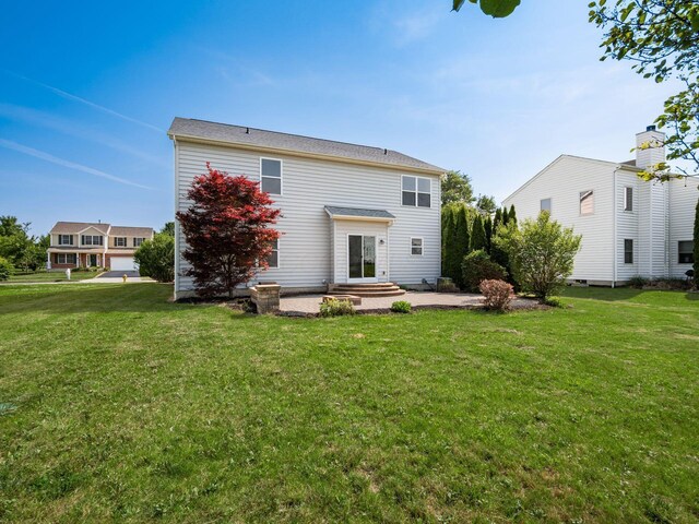 1719 Impatiens Way, Lewis Center, OH 43035 - rear view of property featuring a lawn and a patio