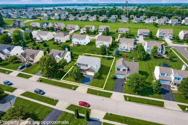 1719 Impatiens Way, Lewis Center, OH 43035 - aerial perspective of suburban area with property boundaries highlighted and a large body of water