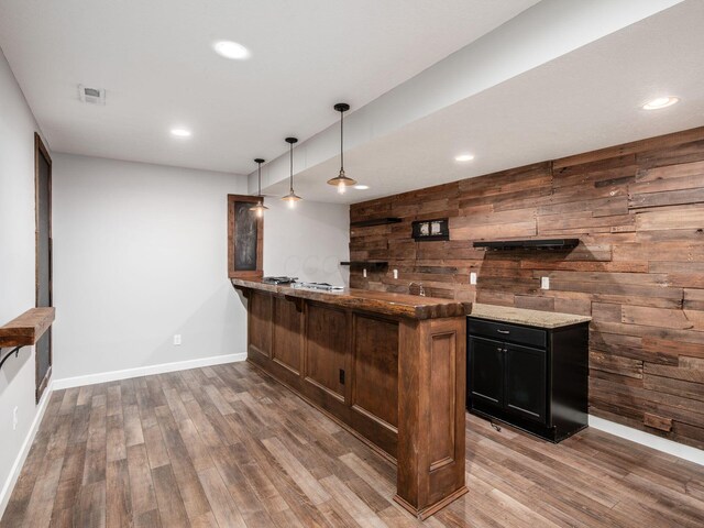 1719 Impatiens Way, Lewis Center, OH 43035 - indoor wet bar featuring wood finished floors, wooden walls, decorative light fixtures, and recessed lighting